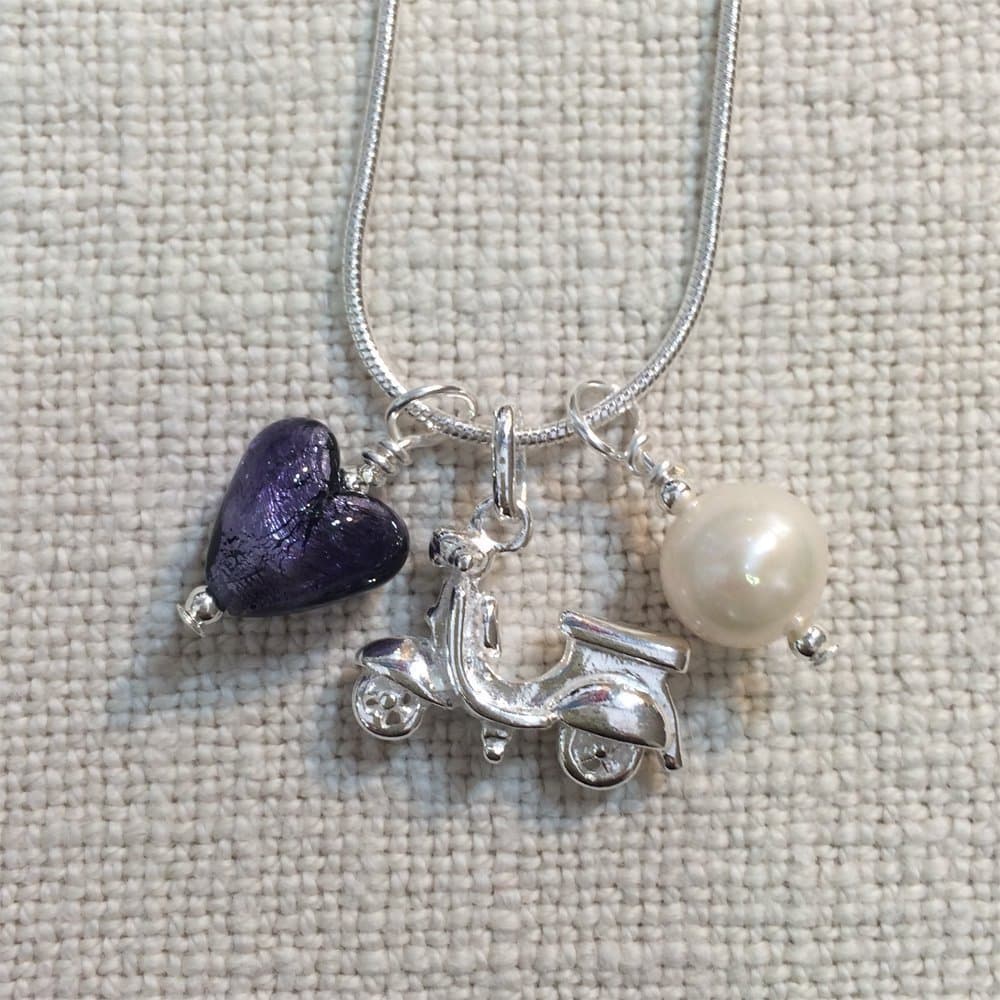 Diana Ingram three charm necklace with purple velvet Murano glass mini heart, silver scooter and white freshwater pearl on Sterling Silver snake chain